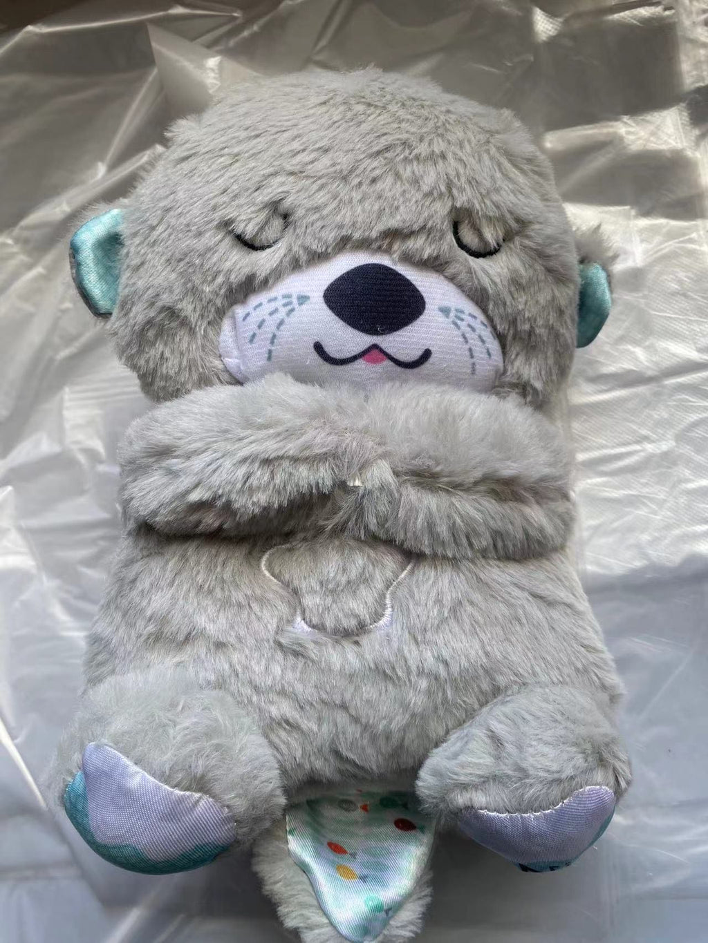 Soundmaschine Soothe 'n Snuggle Otter Tragbares Plüsch-Babyspielzeug mit sensorischen Details, Musik, Lichtern und rhythmischen Atembewegungen